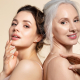 Two beautiful different age woman with perfect skin headshot portrait. Senior lady and young girl in underwear standing back-to-back posing for camera. Spa beauty salon procedure and home skincare